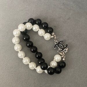 CHANEL Black and White Bead Double-Strand Bracelet with Interlocking CC Charm